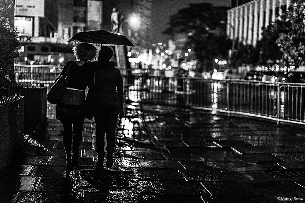 Girls umbrella Rainy Nairobi at Night ©Msingi Sasis.